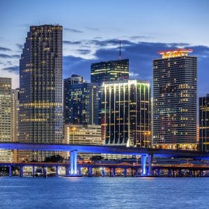 CIty of Miami Florida, illuminated business and residential buildings and bridge on Biscayne Bay